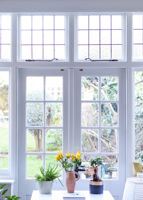 Stylish room interior with french doors and light neutral colours in a modern home